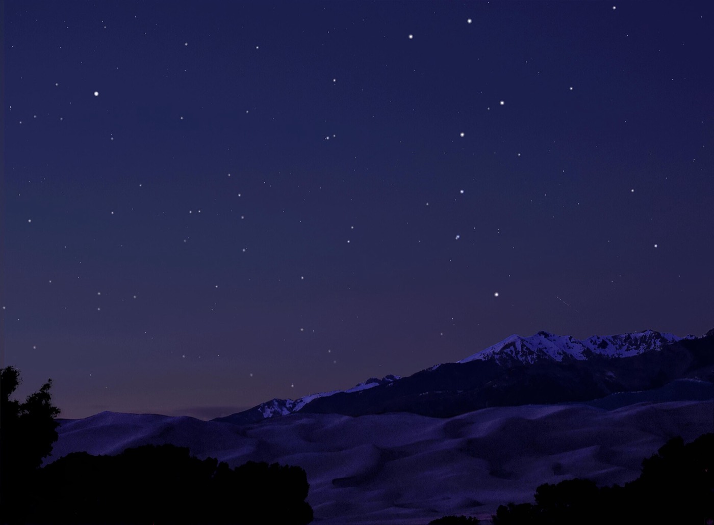The Big Dipper over sand dunes at night
