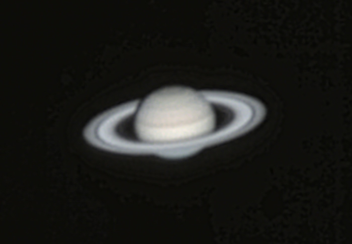 Saturn photographed through a small telescope