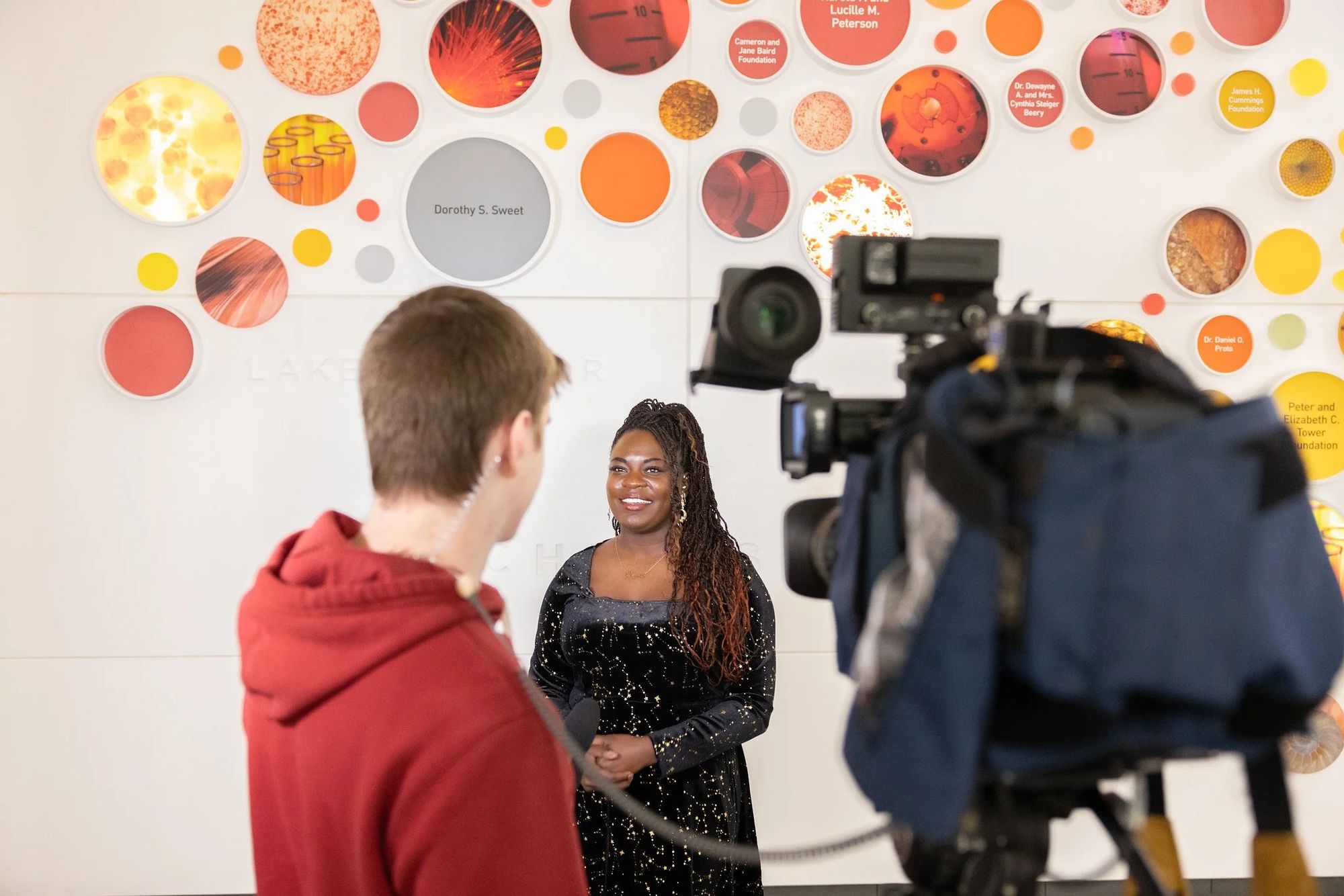 Dr. Raven Baxter speaks with a reporter at the Whitworth Ferguson Planetarium